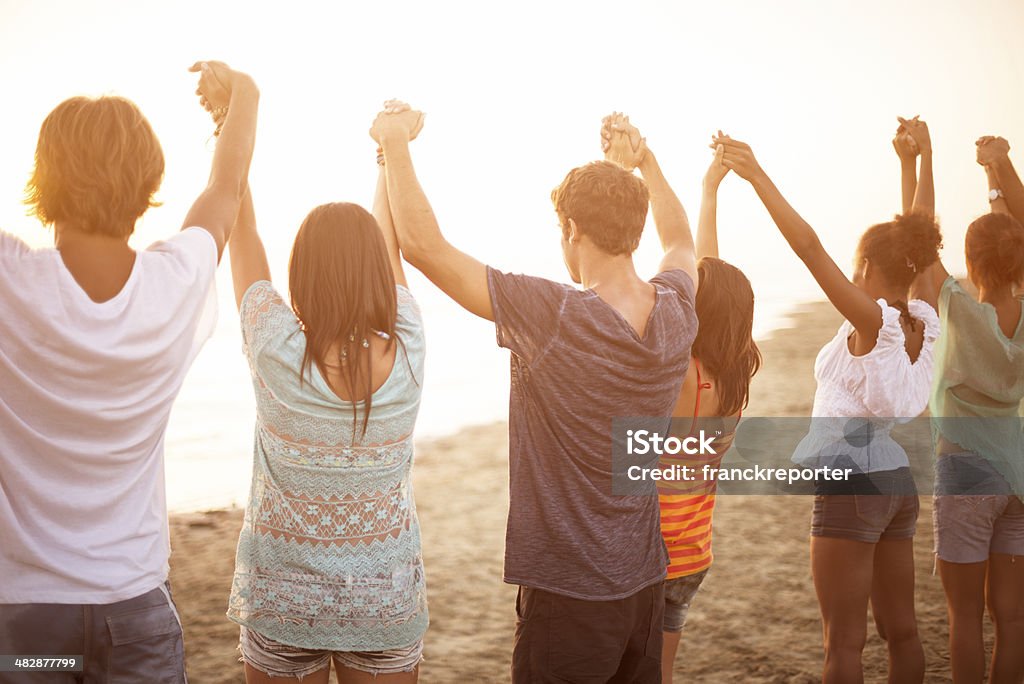 togetherness on the beach http://blogtoscano.altervista.org/dan.jpg  A Helping Hand Stock Photo