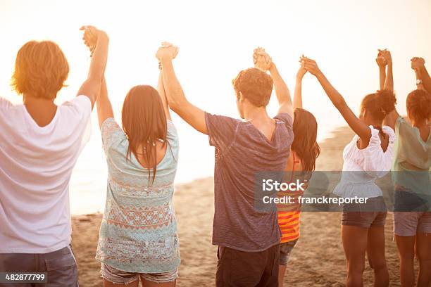 Togetherness On The Beach Stock Photo - Download Image Now - A Helping Hand, Assistance, Beach