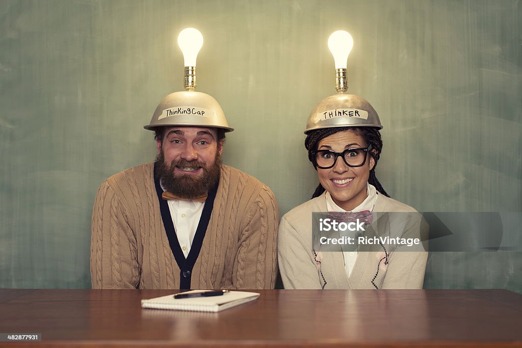 Big Ideas A young nerd couple is having the same big idea at the same time.  Humor Stock Photo