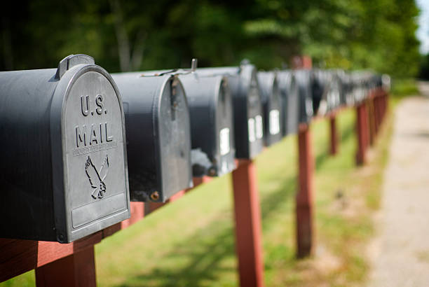 Mailboxes US mailboxes in a row. Adobe RGB. grass shoulder stock pictures, royalty-free photos & images