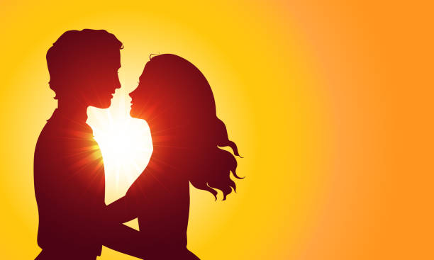 istock Sunset silhouettes of kissing couple 482878155