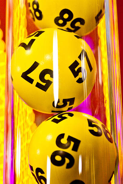 Yellow bingo balls in the tube stock photo
