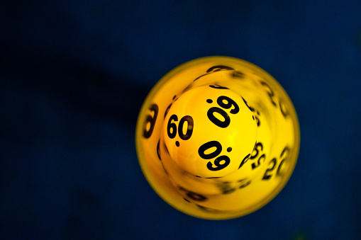 Yellow lottery ball with number 60