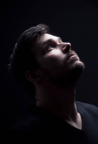 istock Portrait of a young men looking up. 482880688