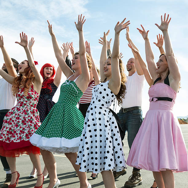 istock Retro Fifties Dancers Hands Raised Up 482891406