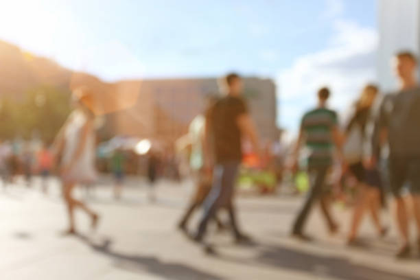 istock Young crowd of people walking on streets, blurred and defocused 482892448