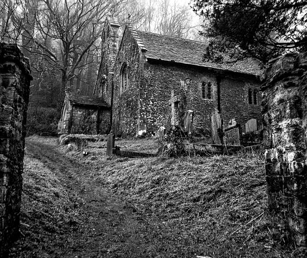 istock Abandoned church with tombstones and graves in an ancient graveyard 482893408