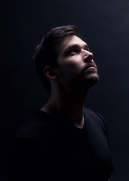 istock Portrait of a young men looking up. 482894210