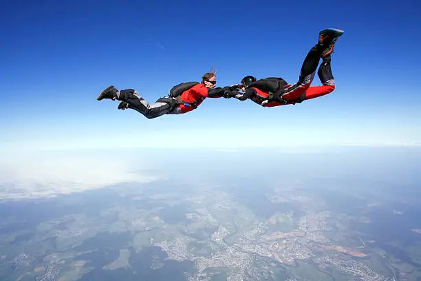 Two skydivers enjoy in free fall