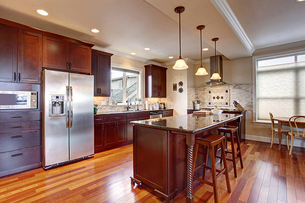 istock State of the art kitchen with deep stained wood. 482900576