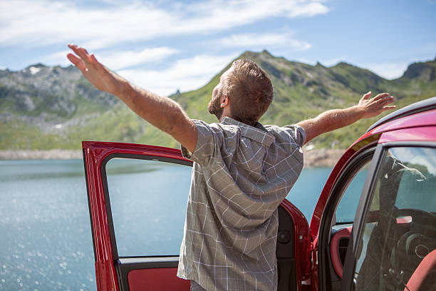istock Cheering man open arms to nature-Road trip 482900822