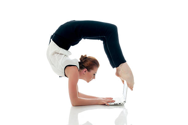 geschäftsfrau yoga und tippen auf netbook - flexibility business gymnastics exercising stock-fotos und bilder