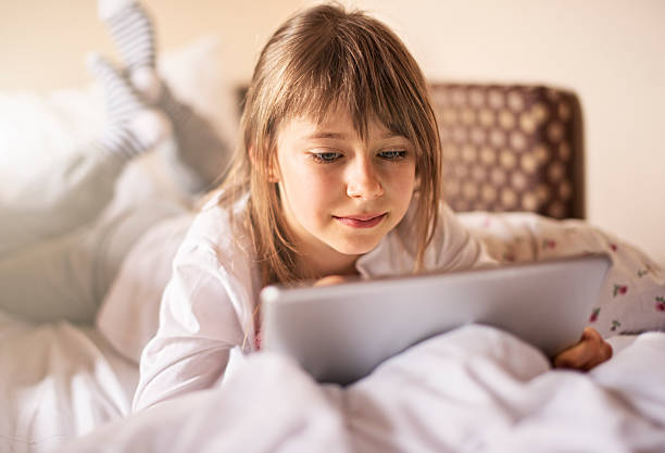 istock Beautiful little girl using digital tablet 482901889