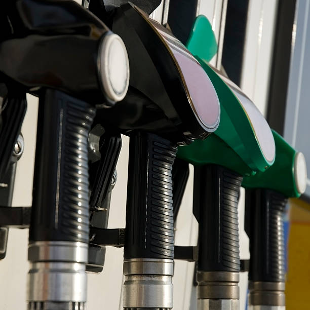 istock Pump nozzles at the gas station (selective focus) 482903761