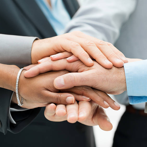 istock Business colleagues with hands stacked together 482904779