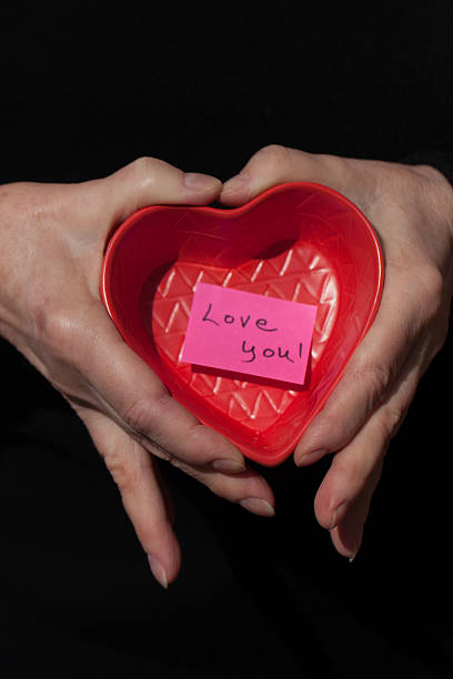 istock Hands holding a heart shaped tray with 
