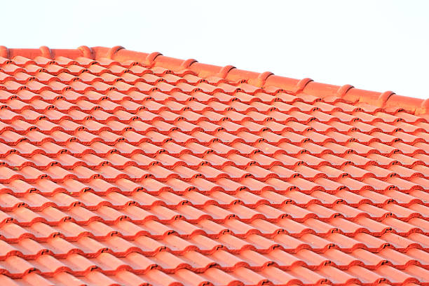 istock construction with stacks of roof tiles for home build 482906083