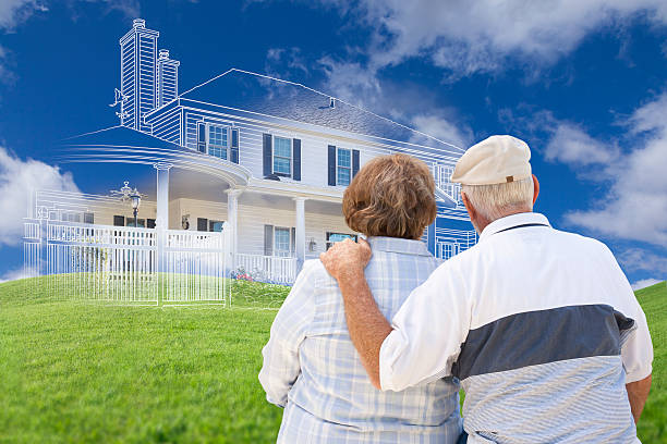 istock Senior Couple Faces Ghosted House Drawing, Green Grass Hill Behi 482912004