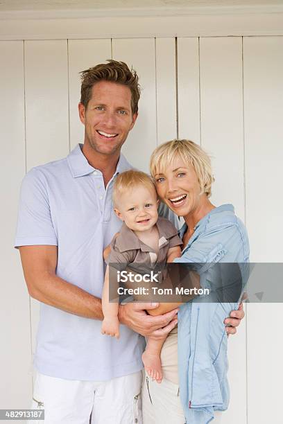 Man And Woman With Baby Stock Photo - Download Image Now - Child, 12-17 Months, 30-39 Years