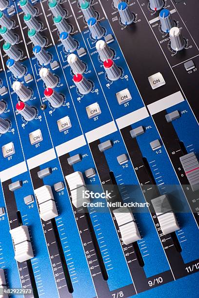 Blue Mixing Board Faders And Knobs Stock Photo - Download Image Now - Audio Equipment, Control, Fader - Sound Equipment