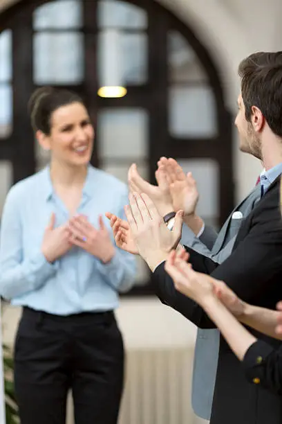 Photo of Business team applauding