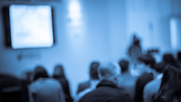 istock Large Group of People Listening to a Presentation 482925078