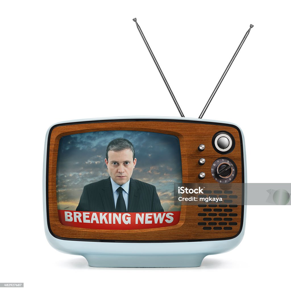 Vintage Portable Television - Breaking News Vintage portable TV with "breaking news" text and anchorman on the screen. TV has a plastic body, wooden front panel and antenna. Isolated on white background. Adult Stock Photo