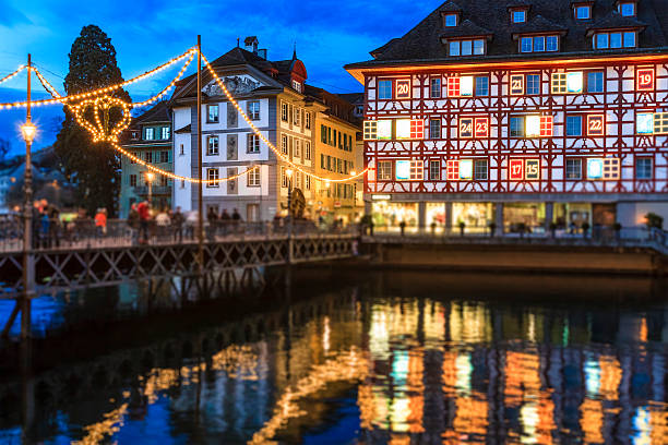 Advent calendar in the old town of Lucerne decorated for Christmas. The beautiful city is located on the shore of Lake Lucerne - der Vierwaldstättersee -, in central Switzerland. Among its landmarks is the Chapel Bridge - Kapellbrücke -, a wooden bridge first erected in the 14th century.