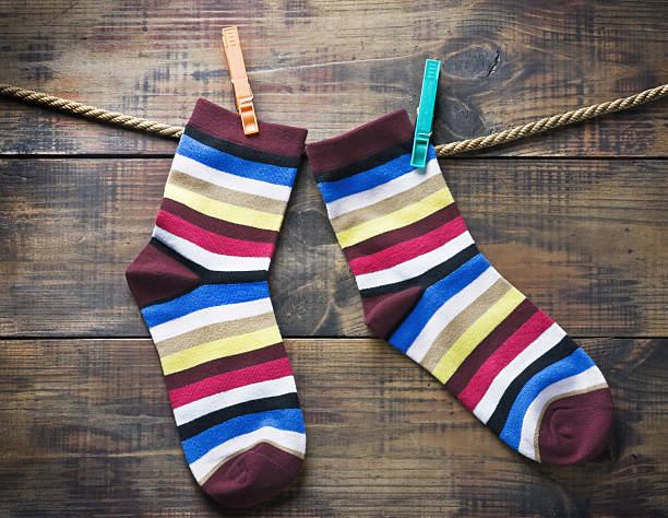 istock colorful socks hanging on clothespins 482928215