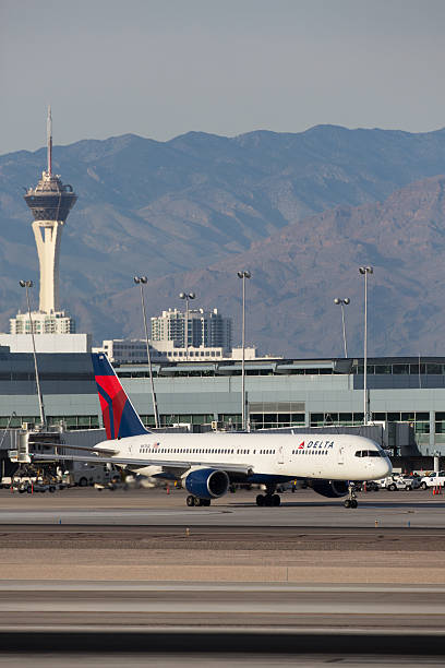 Delta Airlines Boeing 757 Las Vegas, Nevada, USA - January 6th, 2014: A Delta Airlines Boeing 757 taxis to the gate at Las Vegas - McCarran International Airport. boeing 757 stock pictures, royalty-free photos & images