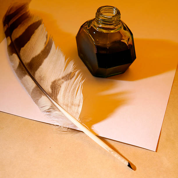 istock Quill pen and inkwell on a blank paper 482930604