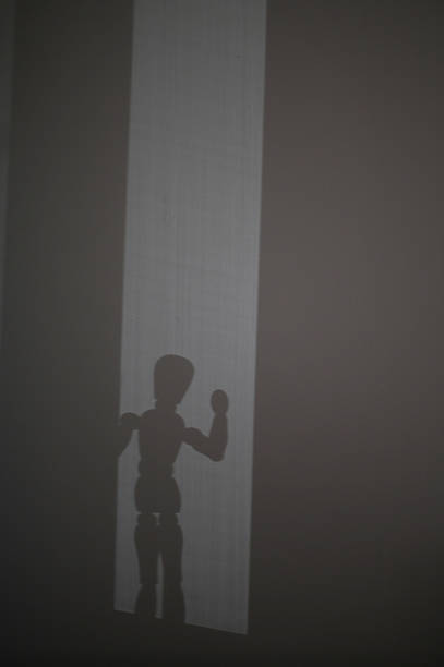 istock Wooden Model's Shadow Waves to You 482939836