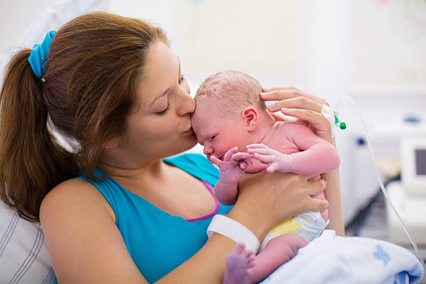 istock Young mother giving birth to a baby 482945202