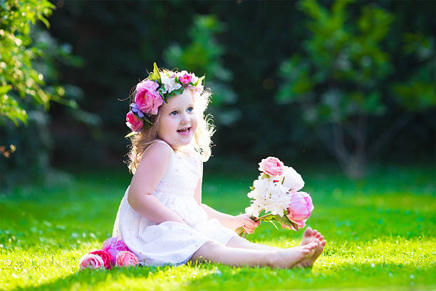 istock Little girl with flowers 482945308