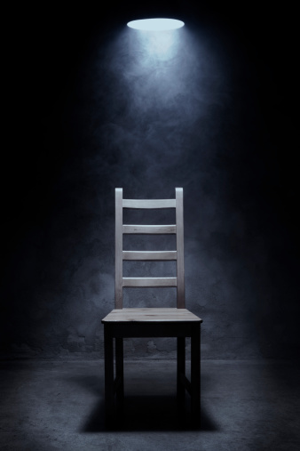 Empty chair in interrogation room