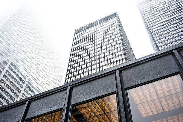 Toronto, Canada - May 5, 2024: The Scotiabank Tower is reflected in the glass walls of skyscrapers in the financial district.