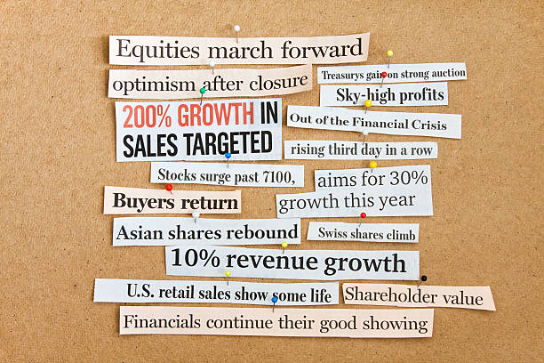 istock Newspaper headlines on corkboard. Financial optimism is back. 482948935