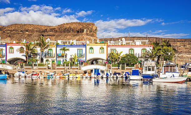 Port of Mogan - Gran Canaria Colorful Canarian style houses and boats in the harbour of Puerto de Mogan, Gran Canaria. grand canary stock pictures, royalty-free photos & images
