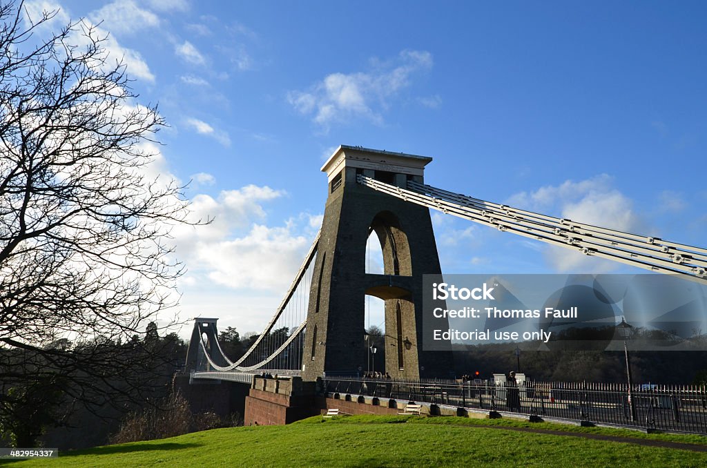Clifton Suspension Bridge Bristol, UK - December 26, 2013: A view of the Clifton Suspension Bridge in Bristol. Various people and vehicles crossing the bridge. Arch - Architectural Feature Stock Photo