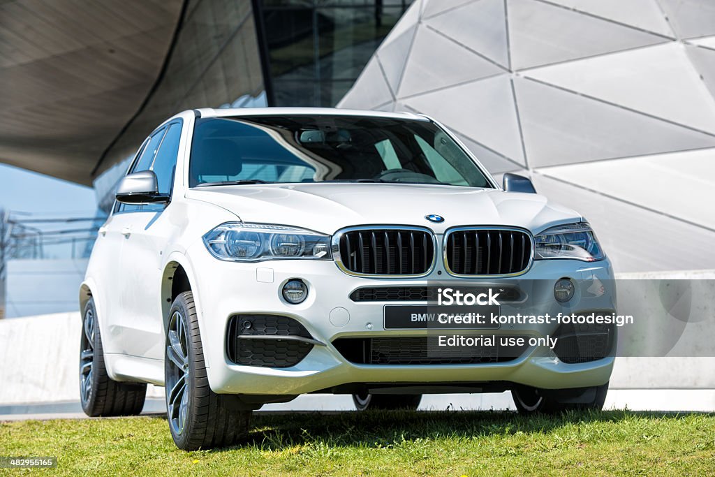 BMW X5 M50d (E70) Munich, Germany- March 28, 2014: BMW X5 M50d  parked in front of the BMW Welt. BMW X5 M (E70) series cars is a mid sized crossover SUV vehicle produced by the German car manufacturer BMW. It was introduced in 2013 .. BMW (Bayerische Motorenwerke AG) is a german automobile manufacturing company based in Munich, Bavaria. BMW Stock Photo