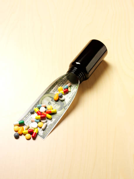 istock 100 American Dollar Bill with Medical Pills 482955207