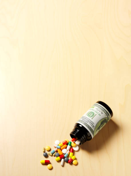 istock American Dollar Note with Medical Pills and Tablets 482955209