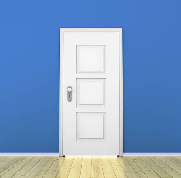 istock Closed white door in a empty blue room 482958852