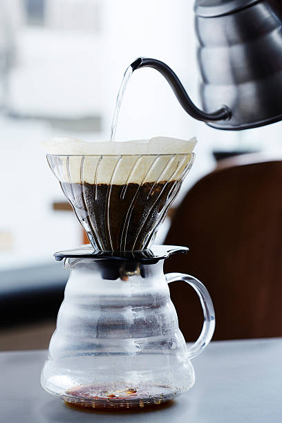 istock Pouring hot water into coffee percolator 482963532