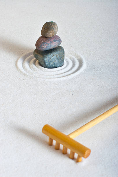 istock Small Zen Garden with stacked stones, rake and white sand 482965335