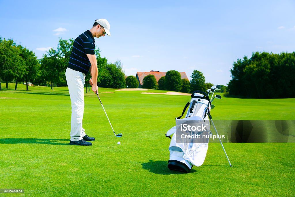 man playing golf man playing golf  40-49 Years Stock Photo