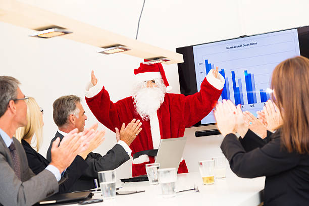 serious business team having a conference with santa
