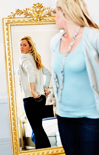 istock Pretty blonde checking rear view in mirror 482966245