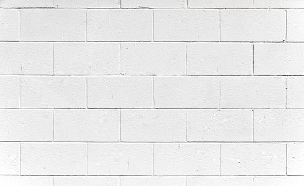 blanco cinderblock pared. - bloque de cemento fotografías e imágenes de stock