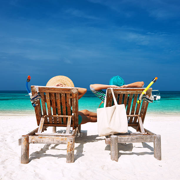 istock Couple in green relax on a beach at Maldives 482966895
